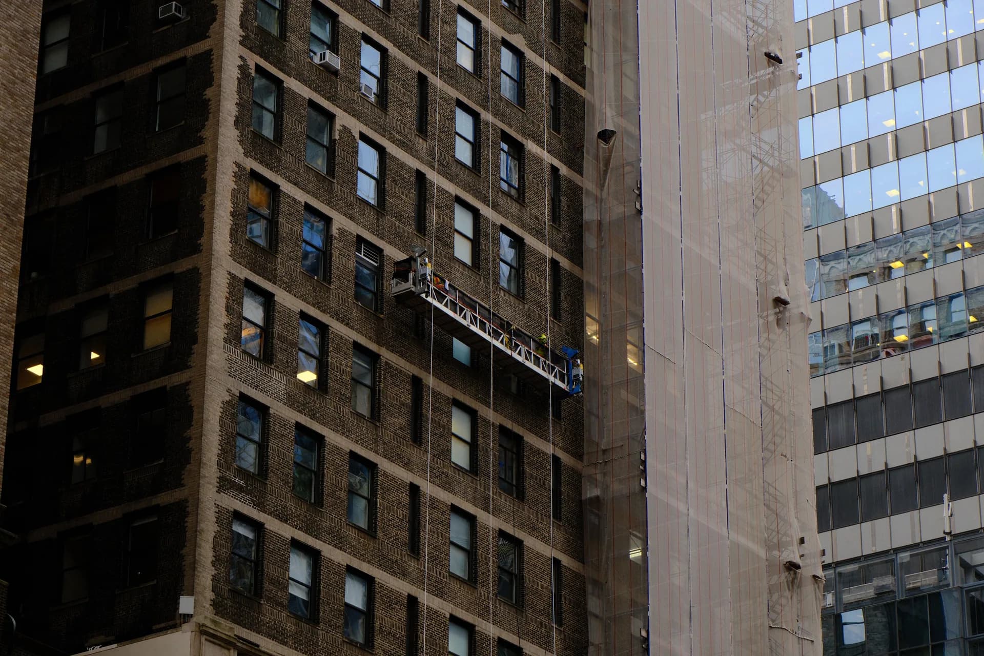 High-rise building maintenance in a city